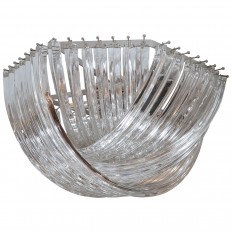 Chandelier composed of overlapping curved glass rods